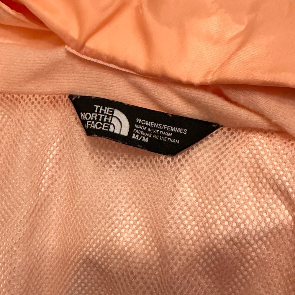 Peach color North face rain jacket